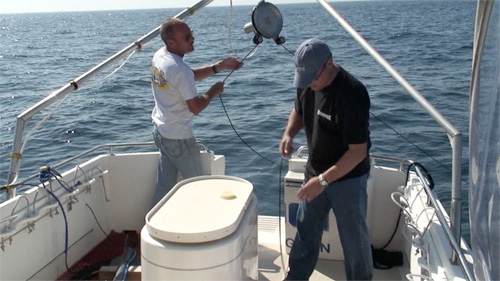 Ray and Gary retrieving the sonar towfish
